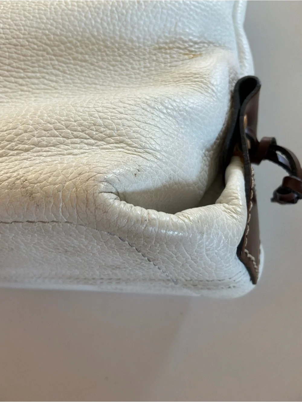 Dooney & Bourke White Pebbled Leather Satchel with Brown Trim and Tassel